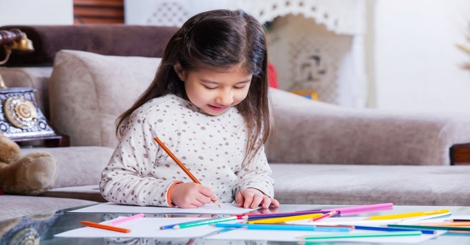 Kid holding the pencil properly